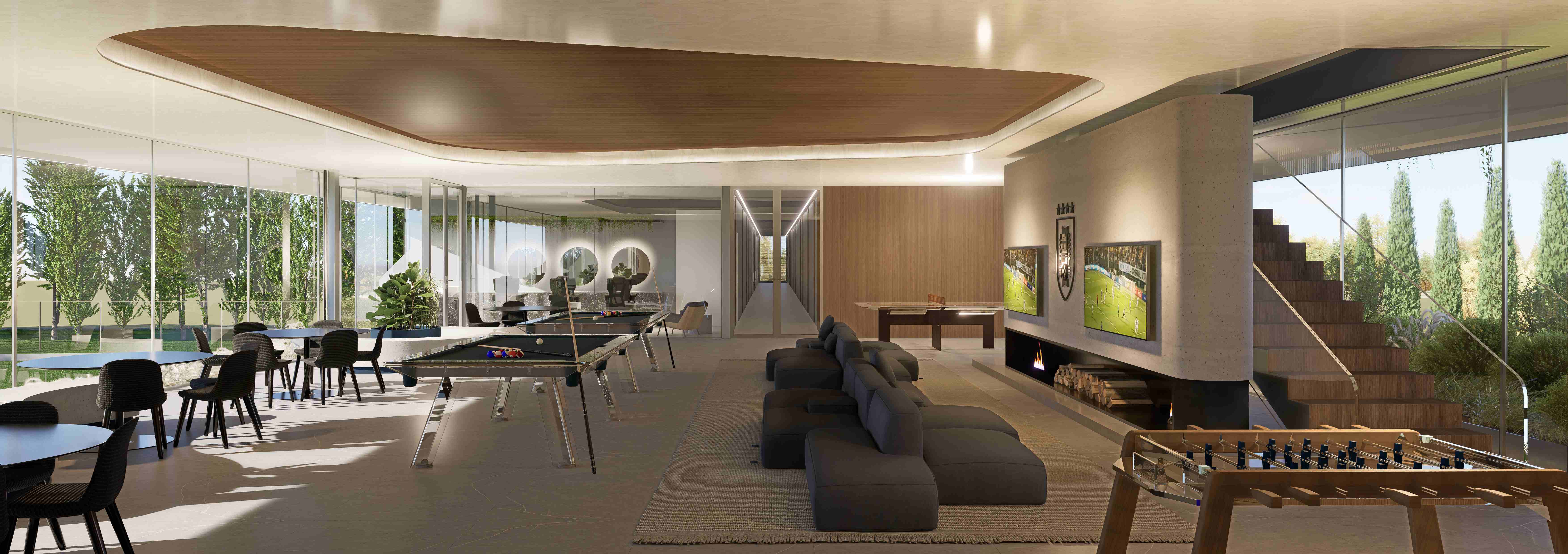 Sala de entretenimiento con mesas de billar, living, hogar y escalera de madera