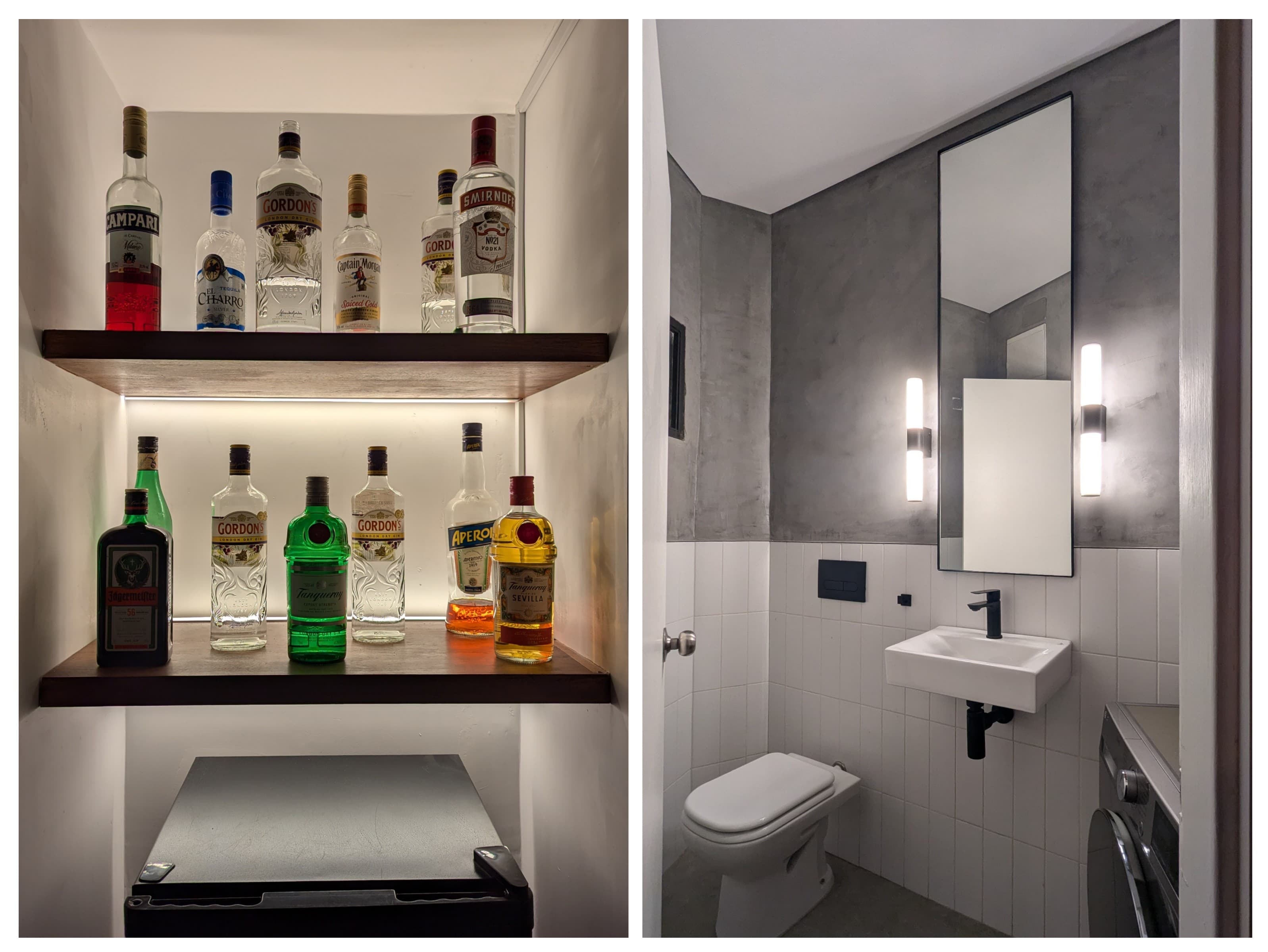 Bar con estantes iluminados para botellas y baño moderno con acabados en concreto y lavabo suspendido